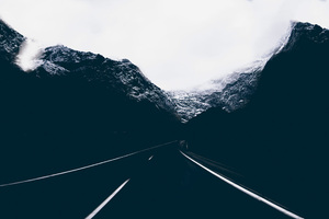 Dark Road Covered By Mountains