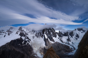Frozen Horizons Patagonian Crag Veiled In Snow And Clouds (1280x720) Resolution Wallpaper