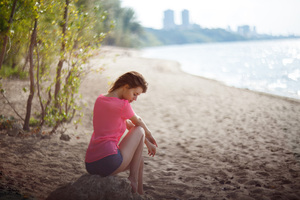 Girl Beach Sitting On Rock (3840x2400) Resolution Wallpaper