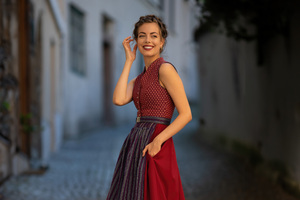 Girl In Red Dress Grins At The Camera (2048x2048) Resolution Wallpaper