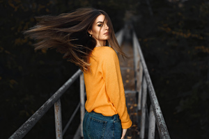 Girl Looking Back Orange Sweater