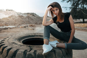 Girl Sitting On Big Tyre (320x240) Resolution Wallpaper