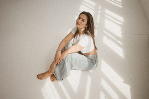 Girl Sitting On Floor Posing 5k Wallpaper