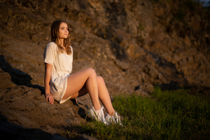 Girl Sitting On Rocks 5k Wallpaper