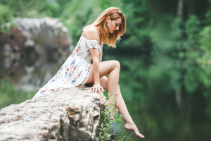 Girl Sitting On The Rock Dangling Her Legs In The Nature Wallpaper