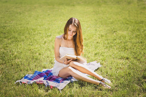 Girl Sitting Outdoor In White Dress Reading Book (1360x768) Resolution Wallpaper