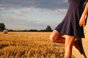 Girl Standing In A Field Wearing Polka Dot Dress (320x240) Resolution Wallpaper