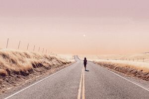 Girl Walking Alone On Desert Road