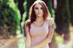 Girl With Tattoo On Arm Wallpaper