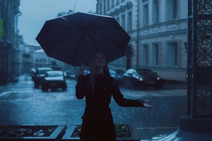 Girl With Umbrella Enjoying Rain