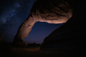 Large Rock Formation With Sky Full Of Stars Wallpaper