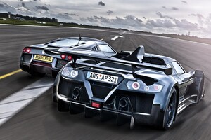Racing Cars On Track (1360x768) Resolution Wallpaper