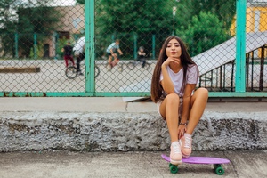 Skateboard Girl Sitting Smiling Portrait Wallpaper