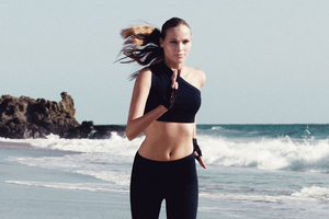 Sports Model Running On Beach