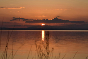 Sun Setting Over Calm Lake (5120x2880) Resolution Wallpaper
