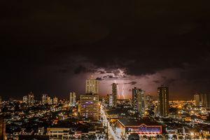 Thunderstorms Above City During Night Time