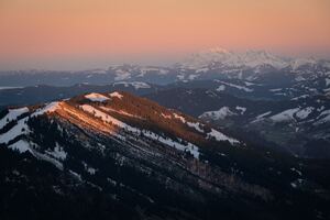 Twilights Embrace Snow Capped Peaks In Sunrise Glow Wallpaper