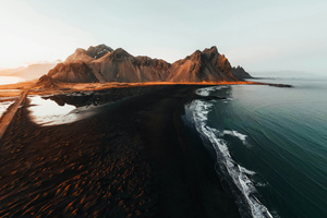 Waves Against The Ember Ridge (1280x720) Resolution Wallpaper