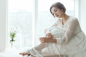 White Dress Girl Sitting Alongside Window Wallpaper