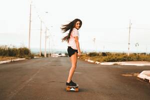 Woman Riding Skateboard At The Road 5k (1600x900) Resolution Wallpaper