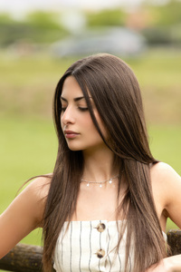 1440x2960 A Lovely Young Woman With Sleek Straight Hair Gazing Downward