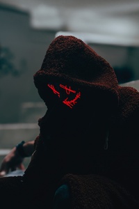A Person Wearing A Hood And Mask In Alley 5k (640x960) Resolution Wallpaper