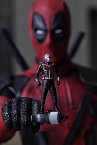 Ant Man Standing On Deadpool Gun