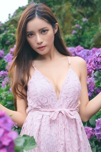 Asian Girl In Purple Flower Field