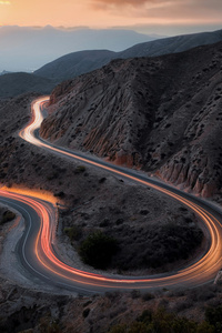 Asphalt Road Long Exposure Betwen Mountains (360x640) Resolution Wallpaper