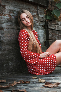 Beautiful Young Woman In Red Polka Dot Dress Sitting On Wooden Bridge (320x568) Resolution Wallpaper