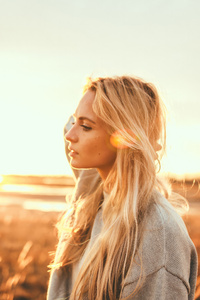 Blonde Girl In A Sunlit Field (540x960) Resolution Wallpaper