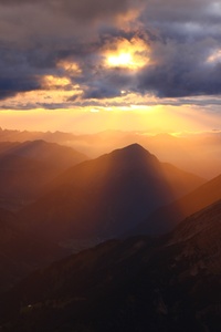 Cloud Rays Over Mountains (1280x2120) Resolution Wallpaper