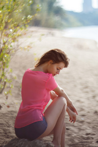 Girl Beach Sitting On Rock (320x480) Resolution Wallpaper