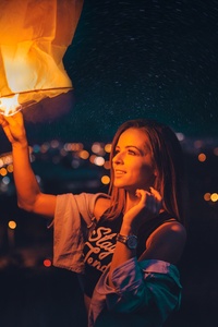 Girl Holding Paper Lantern (640x1136) Resolution Wallpaper
