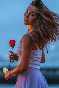 Girl Holding Rose Looking Back 5k