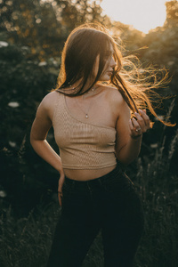 Girl Illuminated By The Gentle Rays Of Sunlight (1080x1920) Resolution Wallpaper