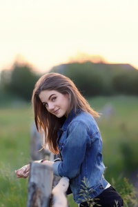 Girl In Denim At Sunset Fields (1440x2560) Resolution Wallpaper