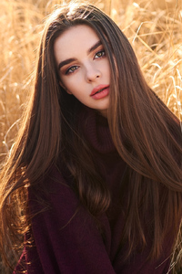 Girl In Field Looking At Viewer (480x800) Resolution Wallpaper