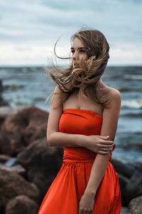 Girl In Orange Dress At Beach 4k (360x640) Resolution Wallpaper