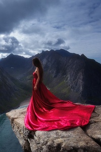 Girl In Red Dress Standing On The Edge Of Mountain Cliff (1440x2960) Resolution Wallpaper