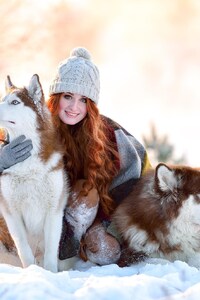 Girl In Snow With Siberian Husky