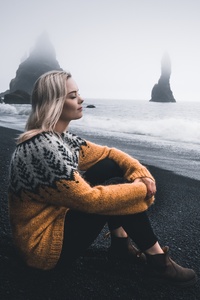 1080x2280 Girl In Sweater Sitting With Eyes Closed Sitting At Beach