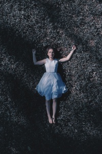 Girl Laying Down On Ground 5k (240x320) Resolution Wallpaper