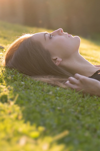 Girl Lying Down Back Grass 8k (640x960) Resolution Wallpaper