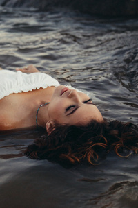 Girl Lying On Sea Shore Wet 5k (1080x1920) Resolution Wallpaper