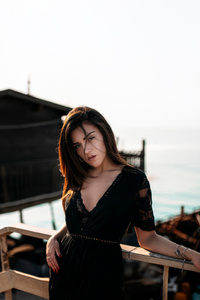 Girl Pier Side Black Clothing (1080x2400) Resolution Wallpaper