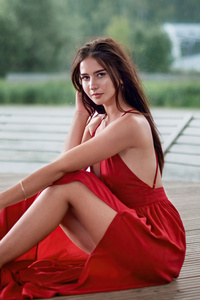 1242x2688 Girl Red Dress Smiling Sitting Outdoor