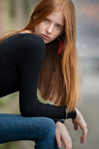 Girl Sitting Black Sweater Long Hairs Looking Side 4k (1440x2560) Resolution Wallpaper