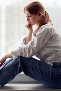Girl Sitting By The Window In Jeans (540x960) Resolution Wallpaper