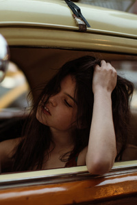 Girl Sitting In Car With Luggage On Top (360x640) Resolution Wallpaper